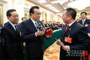 為中國制造“加油”  總理手中的中國紅-東風(fēng)天龍旗艦